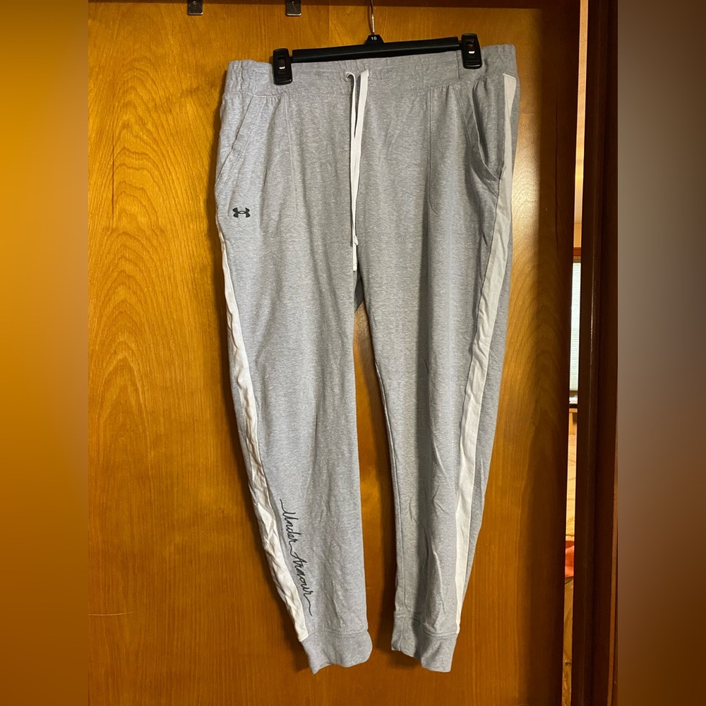 Under Armour Women’s Light Gray Joggers with White stripes.